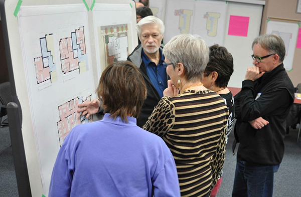 Prairie Spruce members and potential members in a community design meeting with an architect.